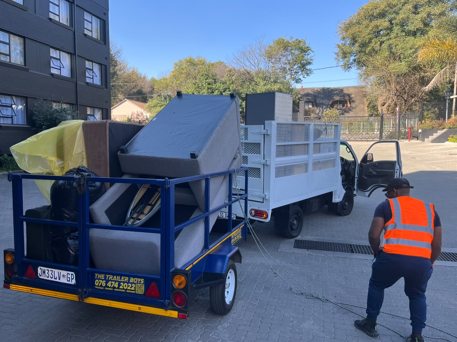 J&C Mukansi Group moving truck — rear